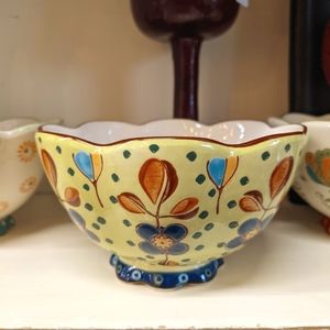 Anthropology Dutch Wax scalloped edge yellow flowered bowl.